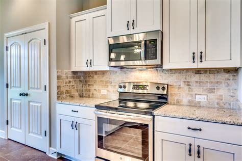 stainless steel dishwasher white cabinets|white countertops for kitchen cabinets.